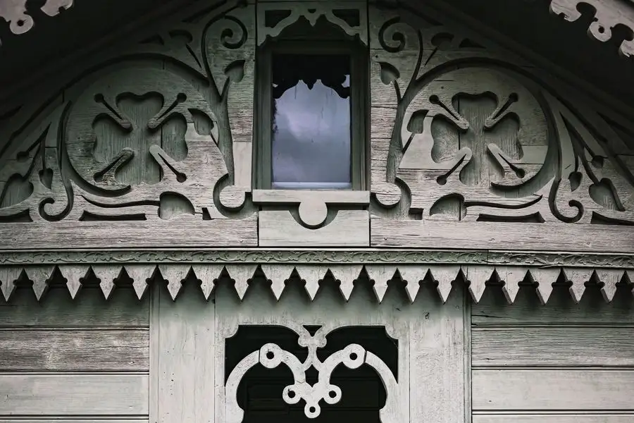 Carved timber facade detail on an old house
